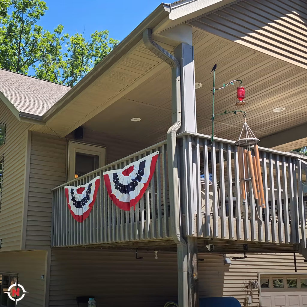 Gutter and downspout system installed around a covered deck in Western Wisconsin
