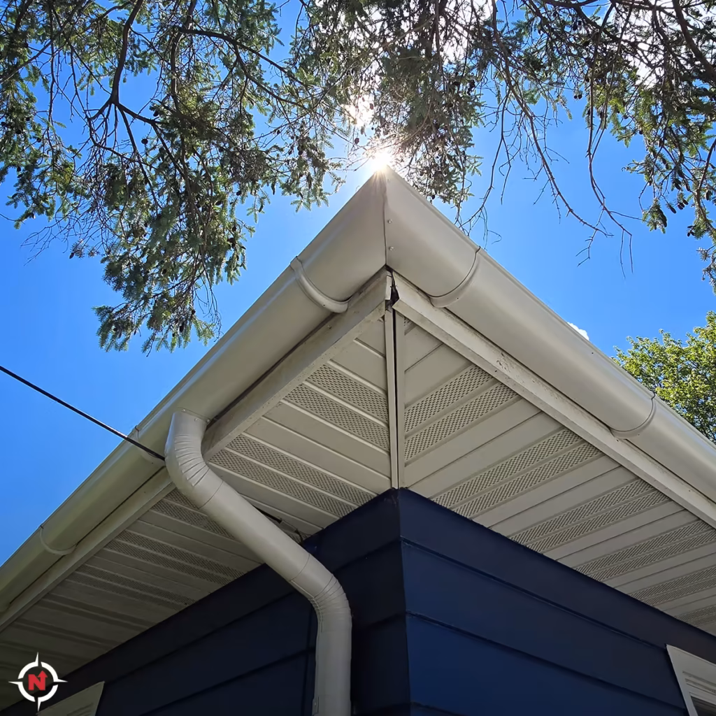Custom white half-round gutter installation on a home in Eau Claire, Wisconsin