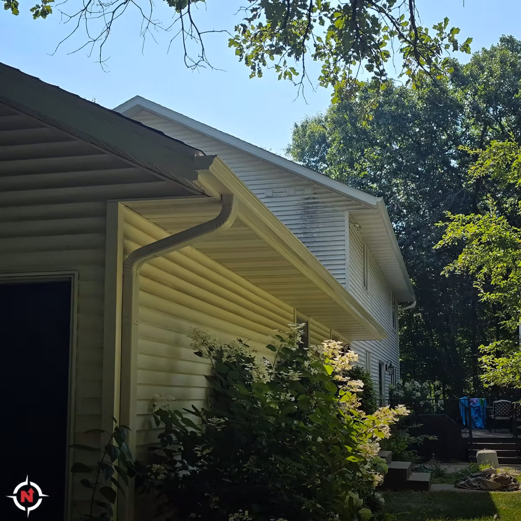 Custom gutter and downspout installation on a two-story Wisconsin home