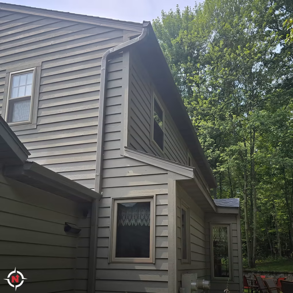 Custom downspout installation for a two-story home in the Chippewa Valley
